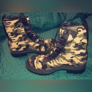 Camo boots that are a stretchy material they have never been worn , are slip on